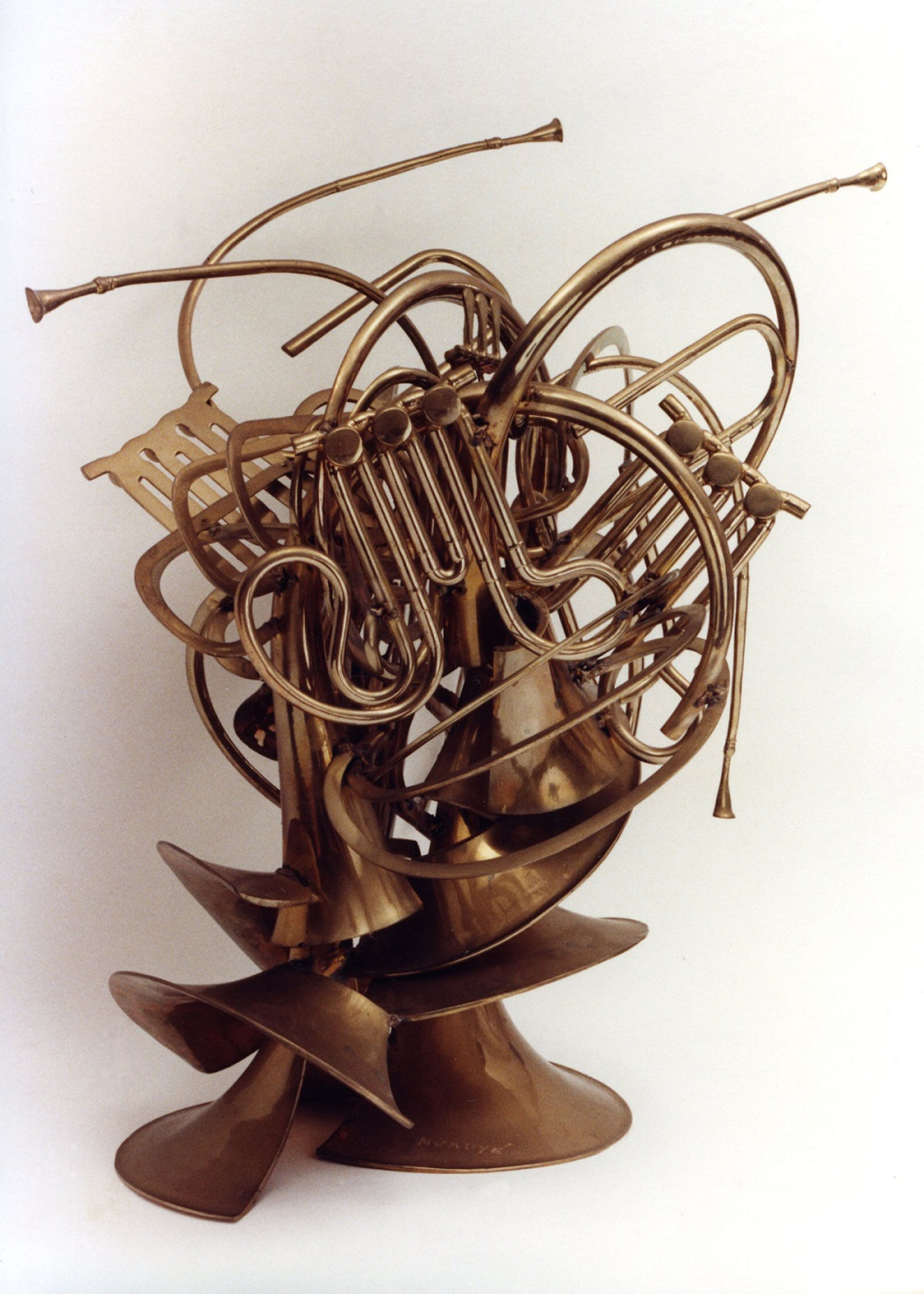 Mumuyé, Arman, 1985, 76x60x67cm, Sliced bronze French horns, welded-lnscribed Mumuyé. Courtesy of The Arman Marital Trust. 