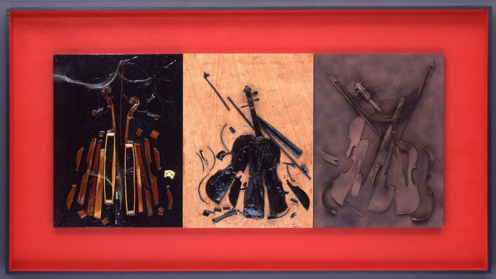 Colere sur Bois, Arman, 2001, 121x222x11cm. Violins sliced, broken and burnt on three wooden panels in a frame, triptych. Courtesy of The Arman Marital Trust. 