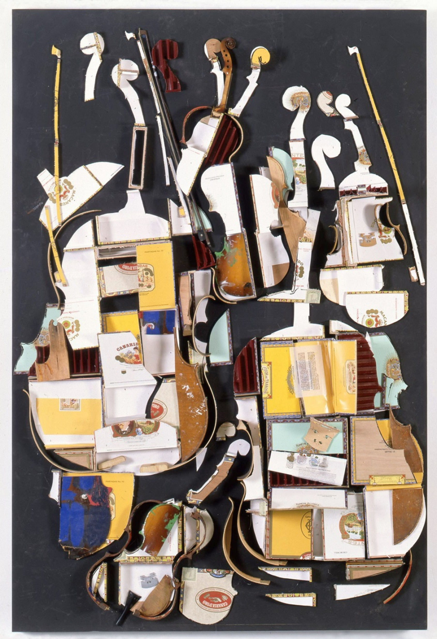 Smokey Quartet, Arman, 1998, 186.7x125.7x22.9cm. Cello and violin shaped cigar boxes with cello and violin parts and bows on wood panel. Courtesy of The Arman Marital Trust. 