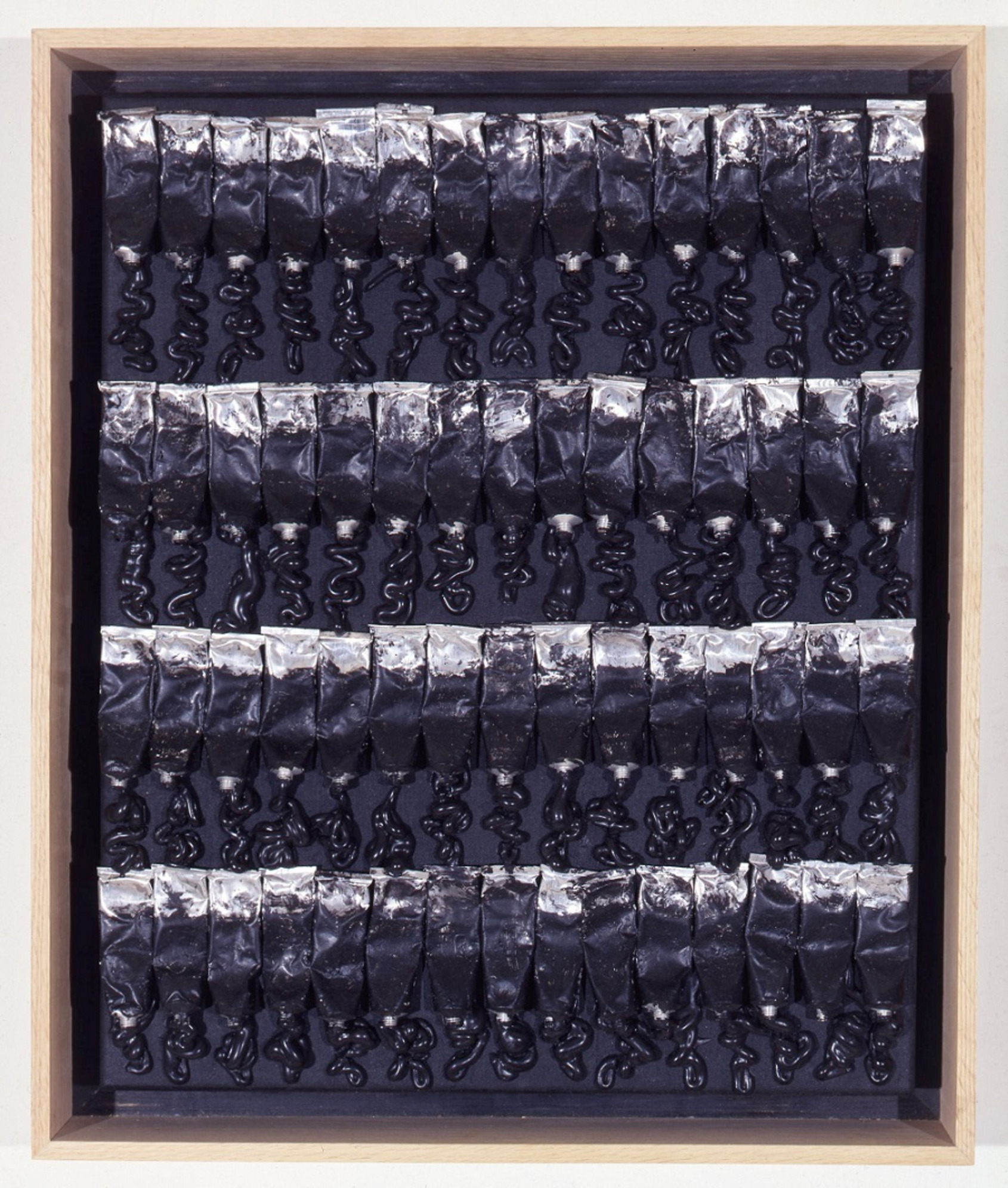 Monochrome No.15, Arman, 1988, 64 x 54 cm. Accumulation of acrylic paint and tubes on canvas. Courtesy of The Arman Marital Trust. 